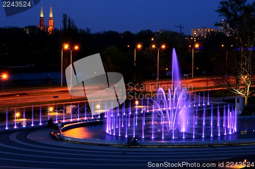 Image of illuminated fountain at night in Warsaw. Poland