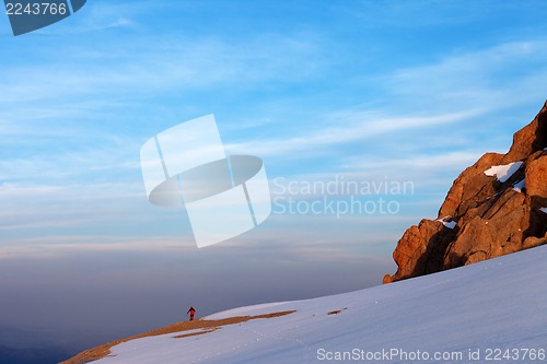 Image of Hiker in sunrise mountains