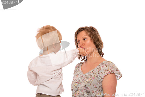 Image of Young boy giving a candy to her mother