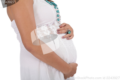 Image of pregnant young woman isolated on a white 