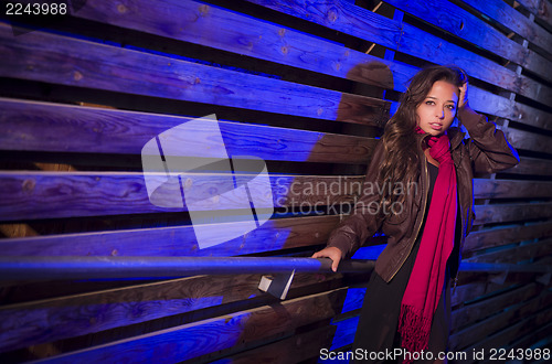 Image of Mixed Race Young Adult Woman Against a Wood Wall Background