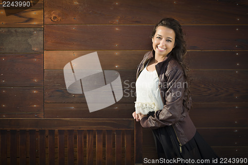 Image of Mixed Race Young Adult Woman Portrait Against Wooden Wall