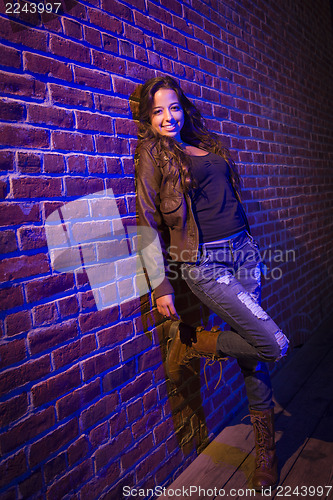 Image of Pretty Mixed Race Young Adult Woman Against a Brick Wall