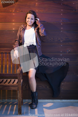 Image of Mixed Race Young Adult Woman Portrait Against Wooden Wall