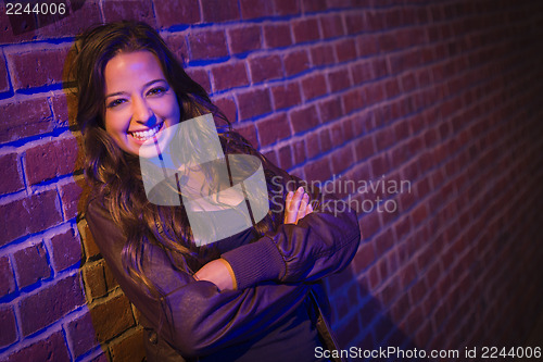 Image of Pretty Mixed Race Young Adult Woman Against a Brick Wall