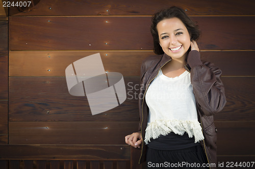 Image of Mixed Race Young Adult Woman Portrait Against Wooden Wall