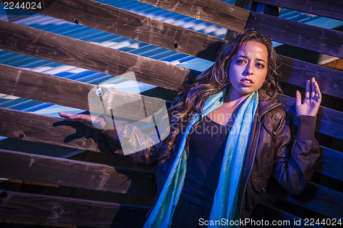 Image of Frightened Pretty Young Woman in Dark Walkway at Night