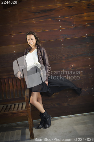 Image of Mixed Race Young Adult Woman Portrait Against Wooden Wall