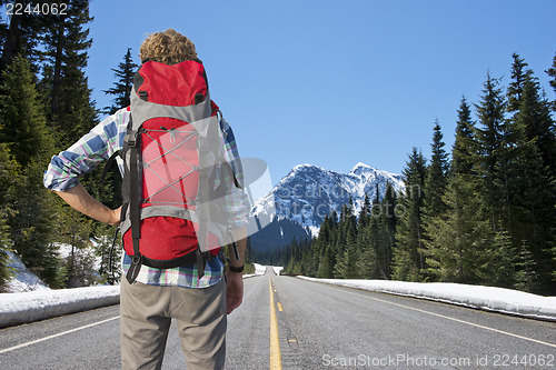 Image of Backpacker on mountain road