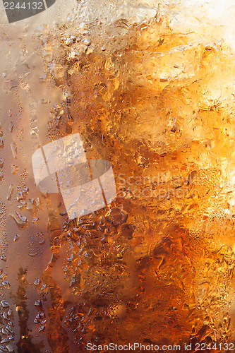 Image of Gradient of fizzy ice cola in a glass 