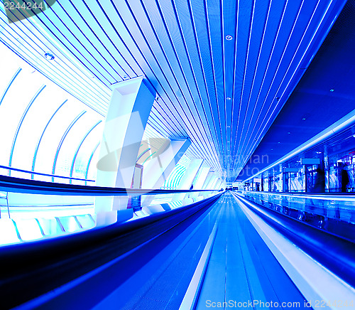 Image of moving escalator in the office hall