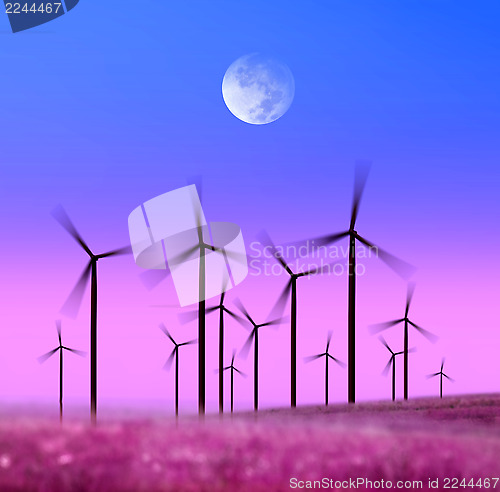 Image of silhouette of wind turbines