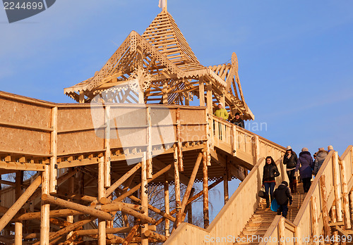 Image of A huge structure of logs for the entertainment of people on a na