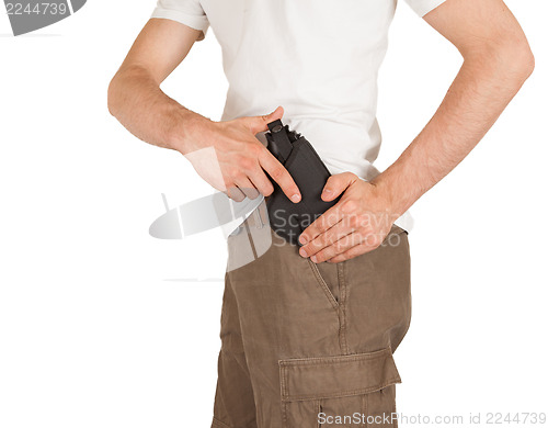 Image of Close-up of a man with holster and a gun