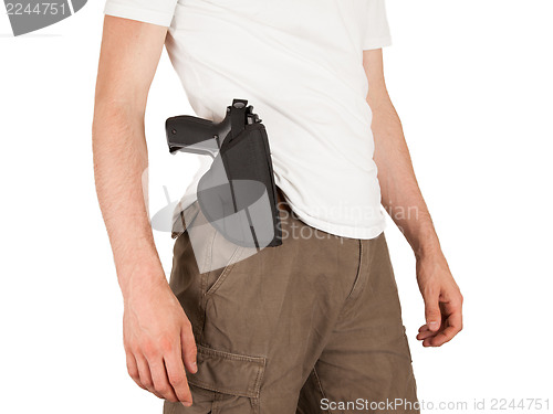Image of Close-up of a man with holster and a gun
