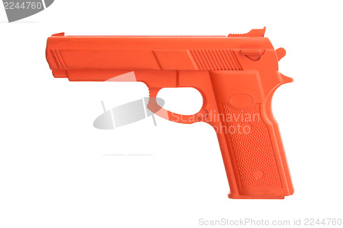 Image of Dirty red training gun isolated on white