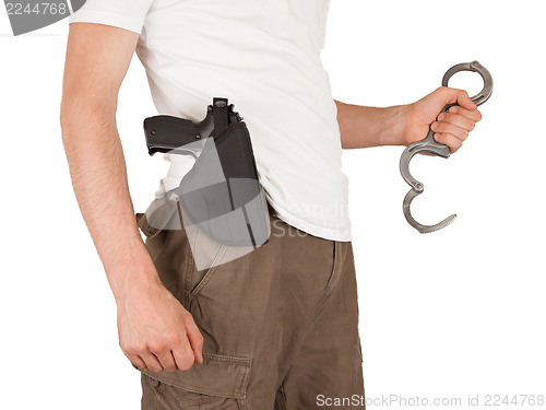 Image of Close-up of a man with holster and a gun