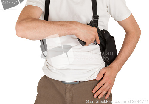 Image of Close-up of a man with holster and a gun