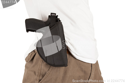 Image of Close-up of a man with holster and a gun