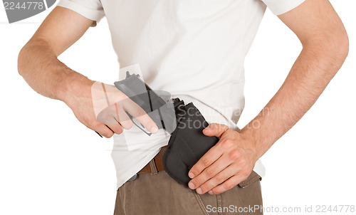 Image of Close-up of a man with holster and a gun