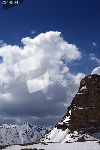 Image of Snowy rocks in clouds