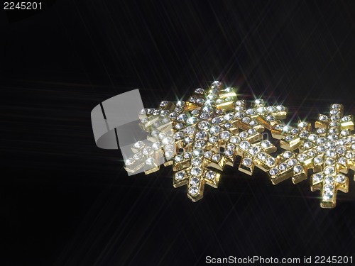 Image of shiny jewellery in dark back