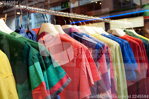 Image of Fashion clothing on hangers at the show