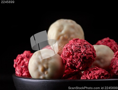 Image of various candies with white chocolate and dried berries