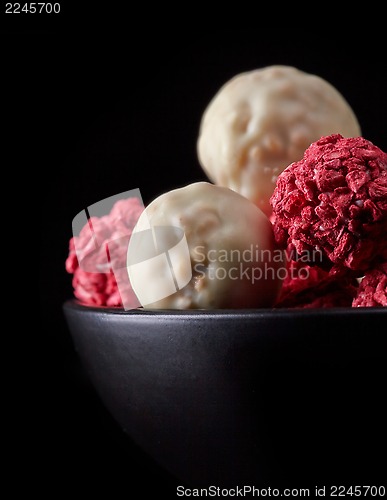 Image of various candies with white chocolate and dried berries
