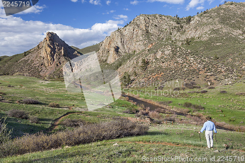 Image of lonely hiker in mountain landscape