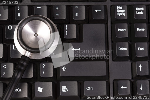 Image of Stethoscope on keyboard, closeup shot