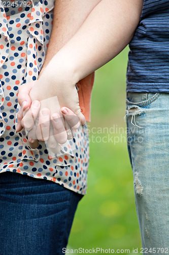 Image of Caucasian Couple Holding Hands