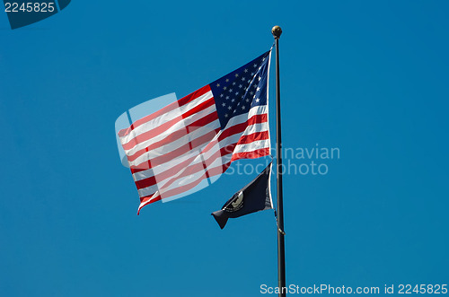 Image of American flag with a POW-MIA flag below it.
