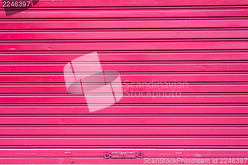 Image of Red roller metal door surface of apartment