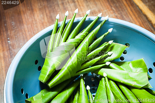 Image of Handmade banana leaf rice offering in basket