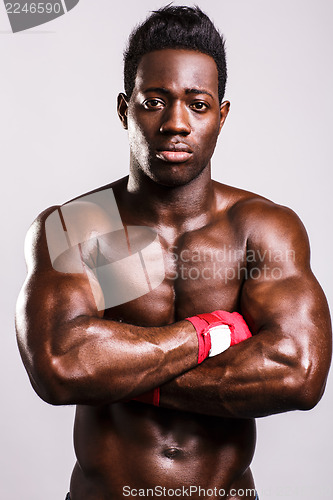 Image of Young handsome athlete, arms crossed