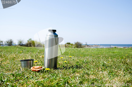 Image of Thermos on grass field