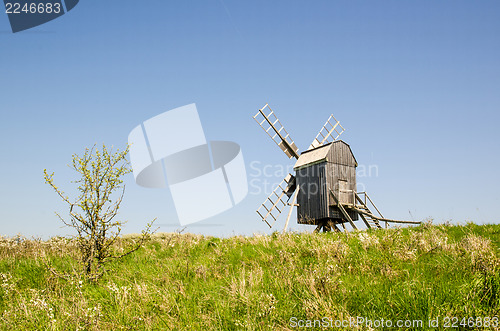 Image of Windmill on green hill