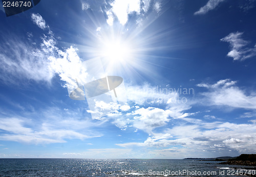 Image of sea landscape with sun and clouds