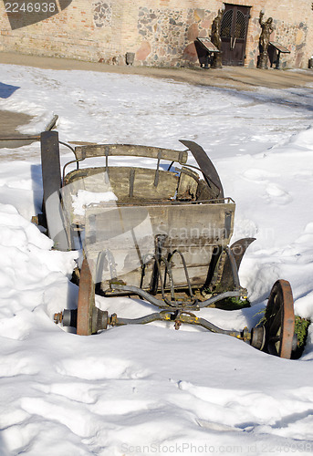 Image of vintage grunge wooden carriage remains snow winter 