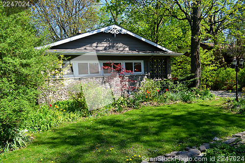 Image of Nice cottage in spring.