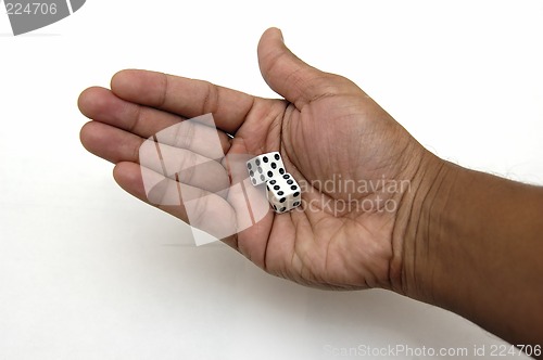 Image of Pair of dice in a hand