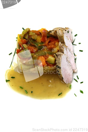 Image of traditional vegetable ratatouille and pig meat 