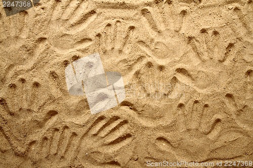 Image of yellow sand texture (human hands)