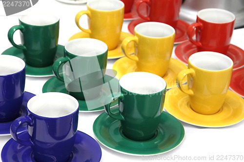 Image of color cups in green, red, blue and yellow colors