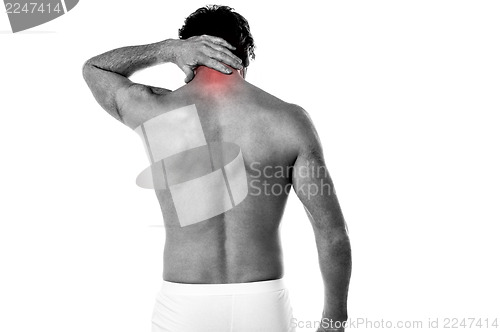 Image of Young man having neck ache