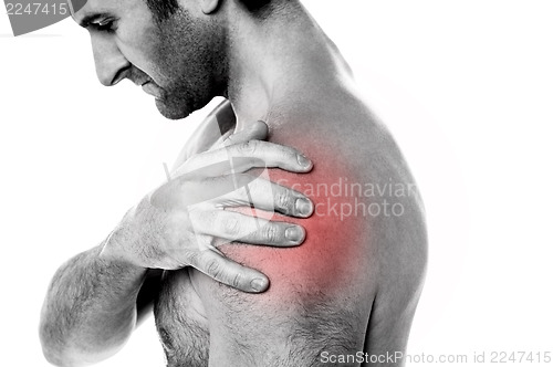 Image of Closeup of young man having pain in shoulder
