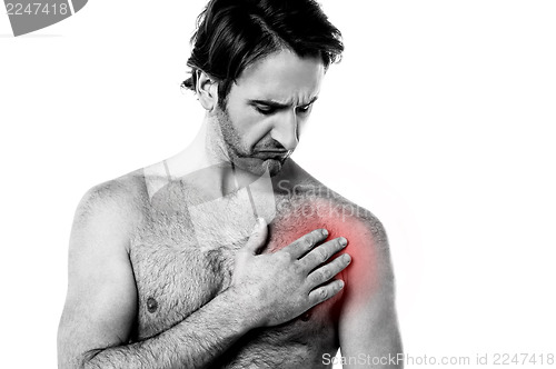 Image of Young man having chest pain