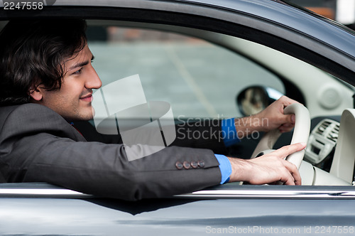Image of Man driving his car