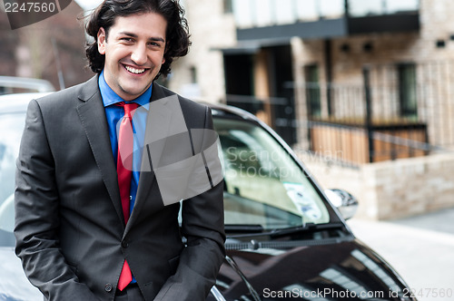 Image of Handsome corporate man posing casually